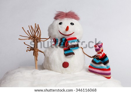Handmade Snowman with a broom and a bag