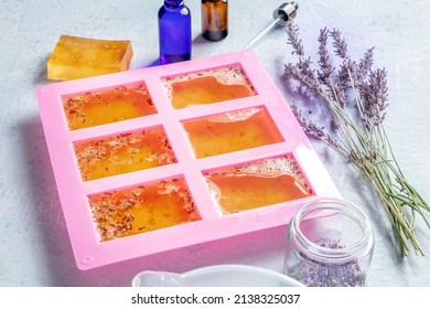 Handmade soap. Diy glycerin base with natural additives solidifies in a silicone mold, with essential oils and a bar of soap