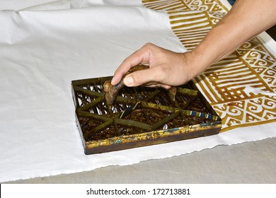 Handmade stamping batik pattern on white cloth 