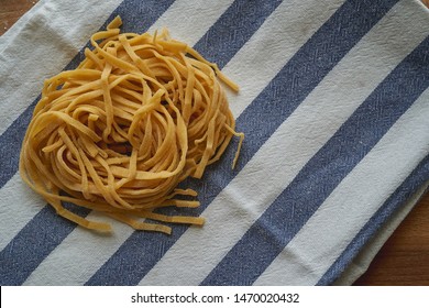Handmade stringozzi (or strangozzi), an Italian wheat pasta similar to noodles, among the more notable of those produced in the Umbria region. Landscape format.