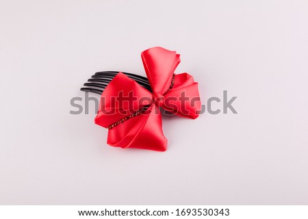 Handmade stylish red bow in the shape of a comb-hair clip for hair made in the namesake of Kansashi
