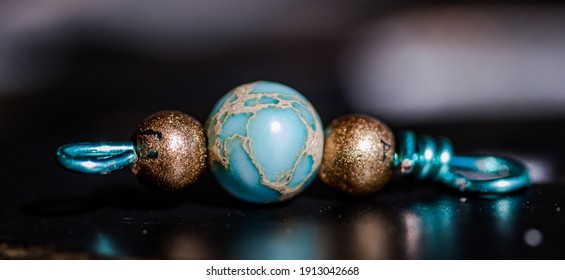 Handmade Wire Beads With Jasper Sea Sediment And Gold Inlay Bead. Turquoise And Gold With Silver. Macro Product Photography Of Handmade Jewelry Components.