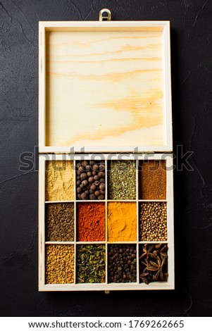 Handmade wooden box, with many compartments, filled with spices. Stock photo © 