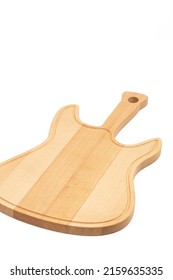 Handmade wooden cuttingboard guitar shape isolated above white background.
