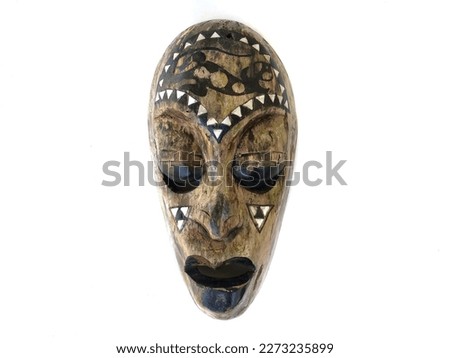 Handmade wooden mask art used for decoration isolated on white background