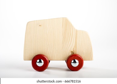 Handmade wooden toy truck isolated on white background - Powered by Shutterstock