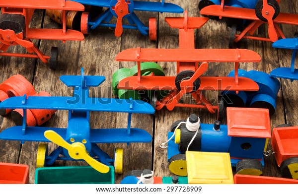 Handmade wooden toys on a\
wooden base 