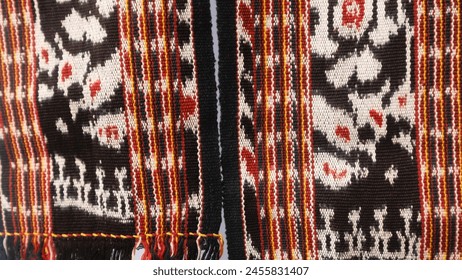 Handmade woven textile with unique pattern from Indonesia, textured ethnic fabric background