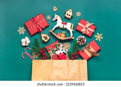 Handmade wrapped red, green gift boxes decorated with ribbons, snowflakes and numbers, Christmas decorations and decor in bag on green table Xmas advent calendar concept Top view Flat lay Holiday card - Shutterstock ID 2229420813