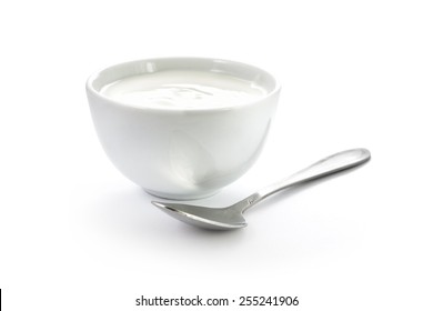 Hand-made Yogurt In A Bowl With Spoon Isolated On White Background