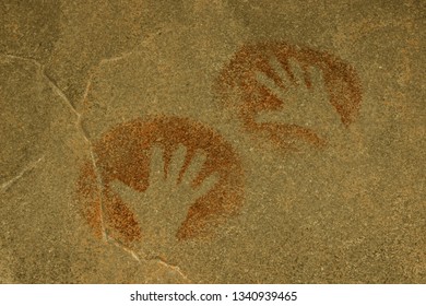 handprints of people painted on the wall of the cave. history of antiquities, archaeology. - Powered by Shutterstock