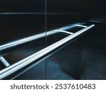 Handrail design in elevator. Handrail serves as a prevention and safety tool, providing support and stability, reducing the risk of accidents or injuries caused by sudden movements of the elevator.