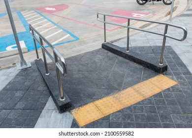 Handrail for disabled and elderly people in concrete ramp way. stainless steel handrail for support wheelchair disabled and elderly people