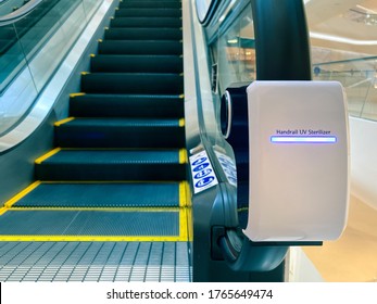handrail ultraviolet sterilizer for hygiene of escalator handrail at shopping mall as pandemic influenza precautions procedure during Covid-19 or coronavirus situation