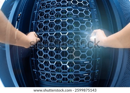 Hands actively engage with a server rack in a high-tech data center, showcasing the advanced technology and meticulous maintenance involved in IT infrastructure management.