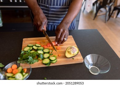 Hands Of African American Senior Man Cooking In Kitchen. Retirement Lifestyle, Leisure And Spending Time At Home.