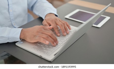 Hands Of African Man Typing On Laptop, Top View 