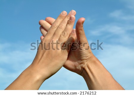 Similar – Men’s hands in the sunlight bruise the palms of their hands. High five close up.