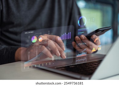 Hands analyzing data digital dashboards with charts and graphs on a laptop and smartphone. KPI key performance indicators and reports management analysis marketing, business trends.