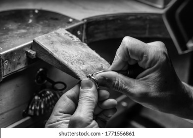 Hands of an artisan jeweler working jewelry. Jewelry Goldsmith - Powered by Shutterstock