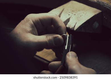 Hands of an artisan jeweler working jewelry. Jewelry Goldsmith - Powered by Shutterstock