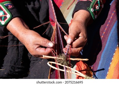 Hands Of Artisans In Peru Weaving The Wool