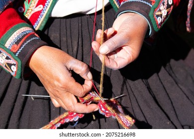 Hands Of Artisans In Peru Weaving The Wool