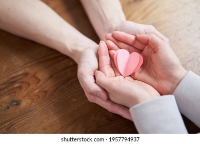 Hands Of Asian Men And Women Who Nurture Love