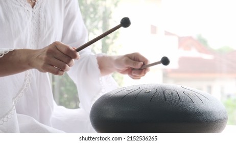 Hands Of Asian Woman Musician Playing Steel Tongue Drum,music And Instrument.