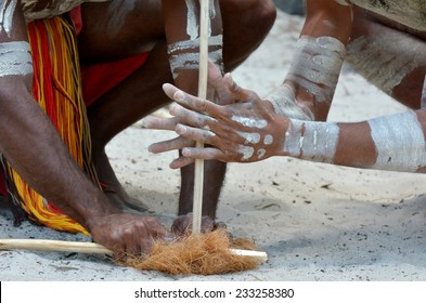 Hands Of Australian Aboriginal Men Demonstrating Fire Making Craft On Aboriginal Australian Culture Show In Tropical North Of  Queensland, Australia.