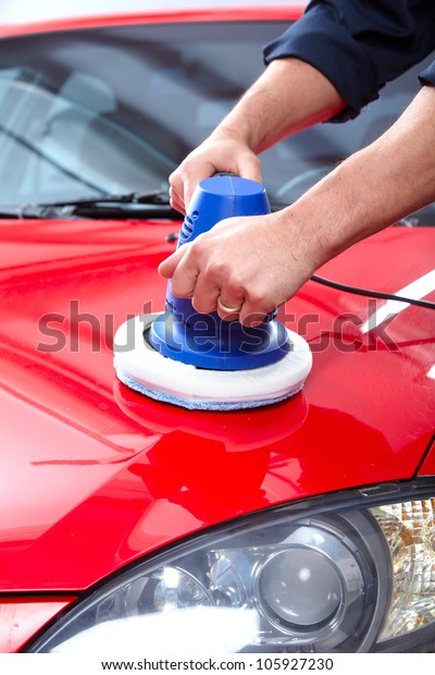 Hands with Auto\
polisher. Car repair\
service.