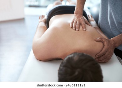 Hands, back massage and chiropractor consulting for injury, rehabilitation with chiropractic for wellness. People, office and together for physiotherapy service for muscle pain with health insurance - Powered by Shutterstock