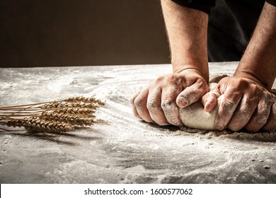 Hands of baker kneading dough isolated on black background. prepares ecologically natural pastries. - Powered by Shutterstock