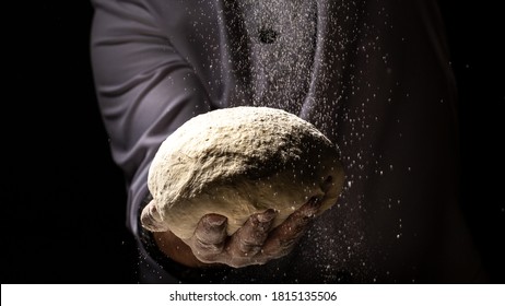 Hands of baker kneading dough isolated on black background. prepares ecologically natural pastries. - Powered by Shutterstock