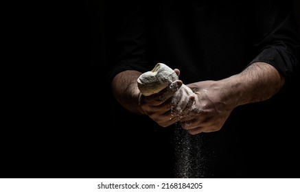 Hands Of Baker Kneading Dough Isolated On Black Background. Prepares Ecologically Natural Pastries. Place For Text.