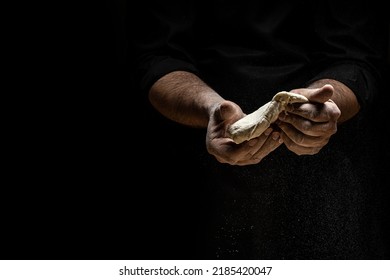 Hands Of Baker Kneading Dough Isolated On Black Background. Prepares Ecologically Natural Pastries. Place For Text.