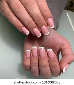 Hands and beautiful long nails   classic French manicure 