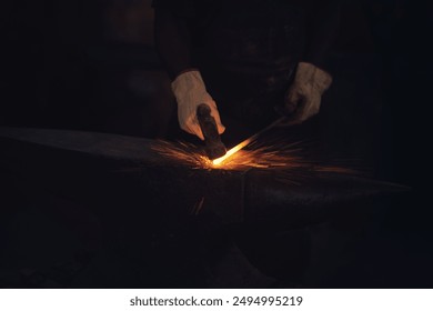 Hands, blacksmith and metal in factory for welding, creativity and glow in small business . Employee, sparks and steel in workshop for career with aluminium, labor and design for industrial company - Powered by Shutterstock