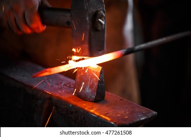 The hands of a blacksmith at work in the smithy - Powered by Shutterstock