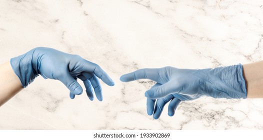 Hands and blue glove based Michelangelo s painting God creating man The Creation Adam