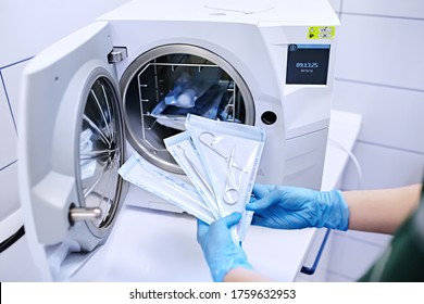 Hands in blue gloves holding a medical instrument. Sterilizing box. Sterilization of instruments. Dentist tools. Sterilization procedure. Steam autoclave.  - Shutterstock ID 1759632953