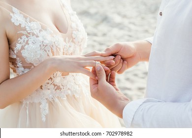 Hands Of Bride And Groom With Ring, Wedding Ceremony Outdoor. 