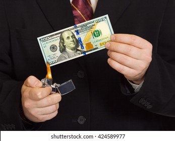 Hands and burnning money - business concept - Powered by Shutterstock