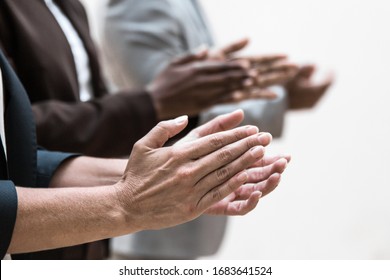 Hands of business colleagues applauding speaker. Business group appreciating presentation, seminar, training or conference. Applause or success concept