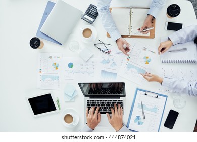 Hands Of Business People Having Meeting At Table, View From Above