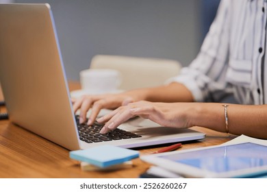 Hands, business person and typing on computer for research, editing email or networking. Laptop, worker and writing on keyboard closeup for publication results or check manuscript in creative startup