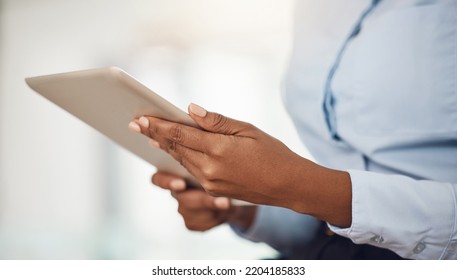 Hands Of Business Woman Working On A Tablet Analyzing Annual Company Data Or Information For Marketing Campaign. Professional Black Girl With Digital Mobile Tech For Research On Consumer Sales Trends