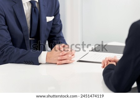 Hands of a businessman having an interview