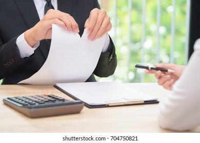 Hands Of Businessman Ripping Agreement Paper When Woman Giving A Pen For Signing, Break The Rules - Failure Business Concept