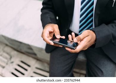 Hands Of Businessman Text Messaging